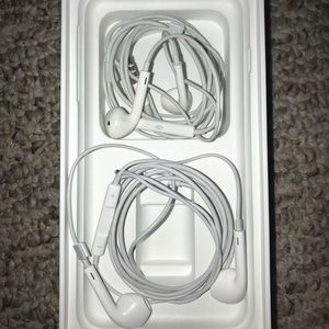 Two like new apple head phones.